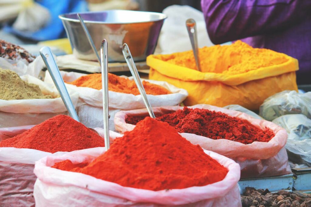 Spices in an Indian market - Bring you senses into your homeschool India unit by tasting, smelling, and using different Indian spices.