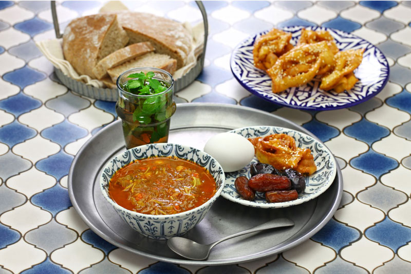 Morocco Ramadan iftar meal, mint tea, harira soup, dates, chebakia (sesame honey cookies), and khubz (bread) - Kids learn about Morocco