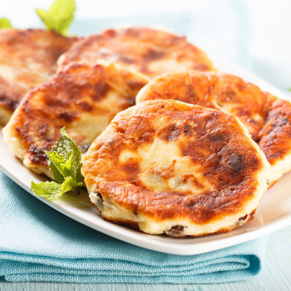 Ukrainian syrniki cheese pancakes - Image from Canva - Ukraine history and culture for kids