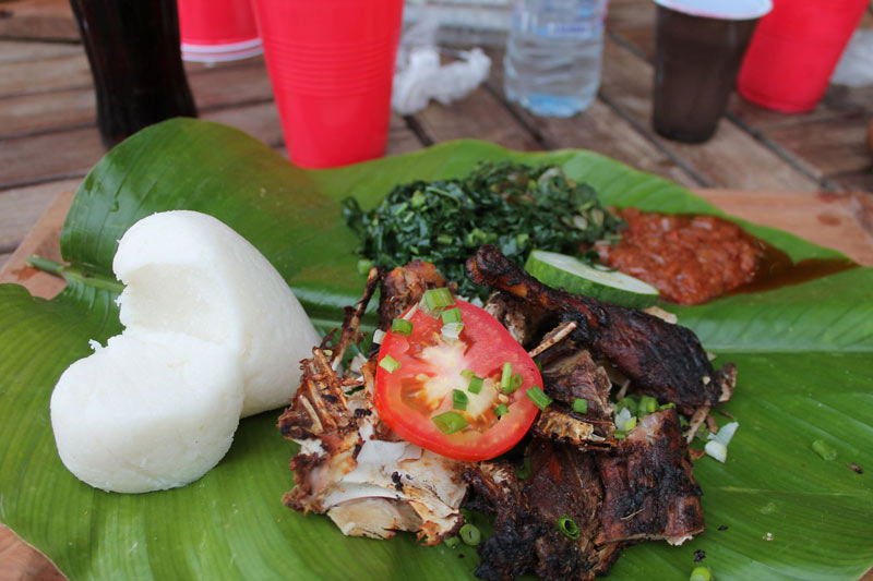 Zimbabwean food - Sadza with vegetables and guinea foul - Image from Canva.com